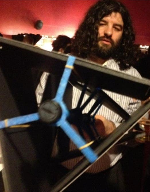 Justin demonstrating a rotating photo display he created